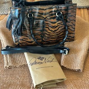 Measures: 13"L x 5-1/2"W x 9-"H; 7-1/4" handle drop, 23" strap drop.